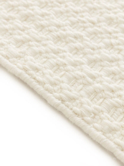 Handwoven wool rug texture