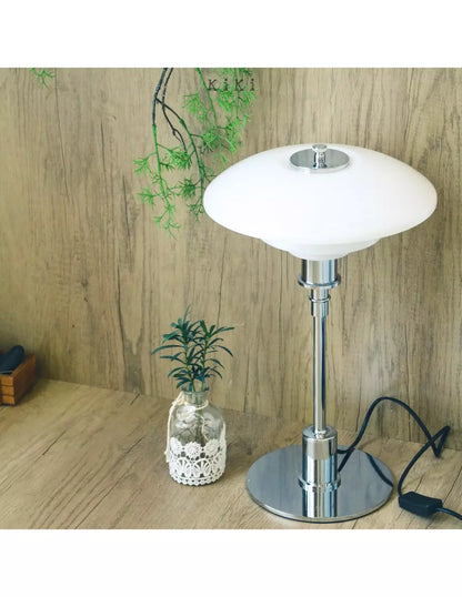 Danish metal table lamp in a disc shape
