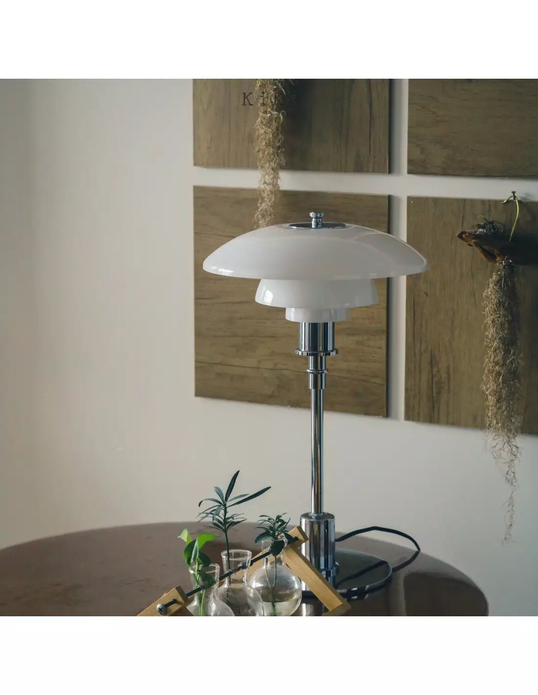 Danish metal table lamp in a disc shape