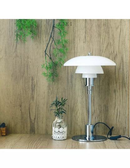 Danish metal table lamp in a disc shape