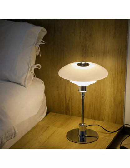 Danish metal table lamp in a disc shape